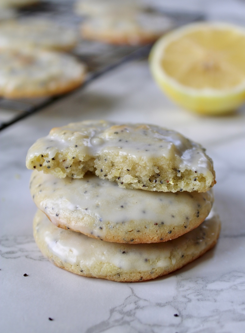 Lemon poppy seed cookies with lemon in background